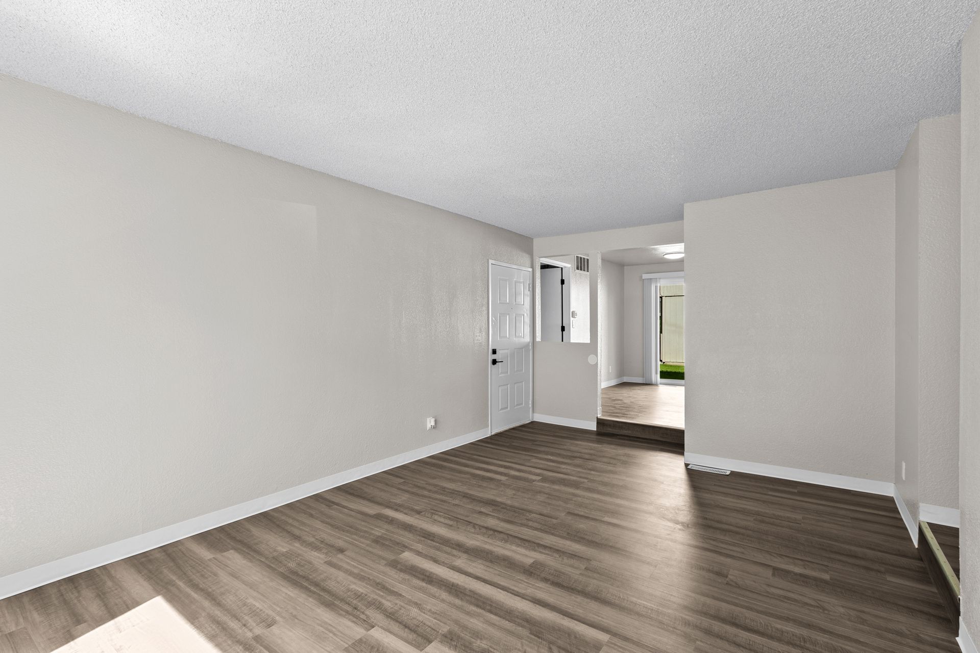 Spacious step-down living room with large window