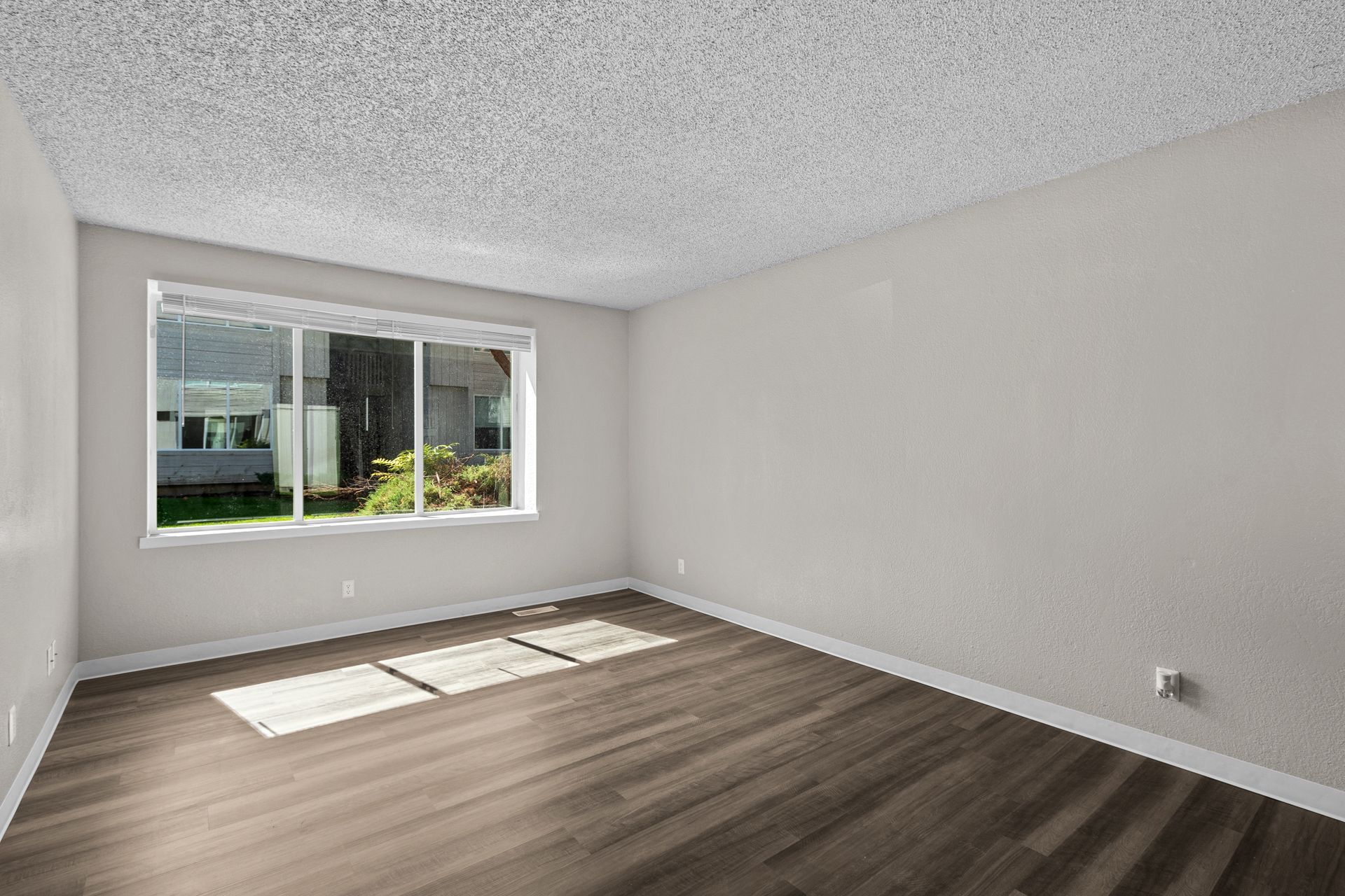 Spacious step-down living room with large window