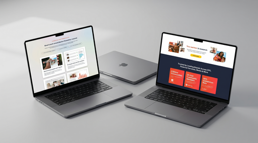 Two open laptops displaying websites on a gray tabletop, with a closed laptop centered behind them.