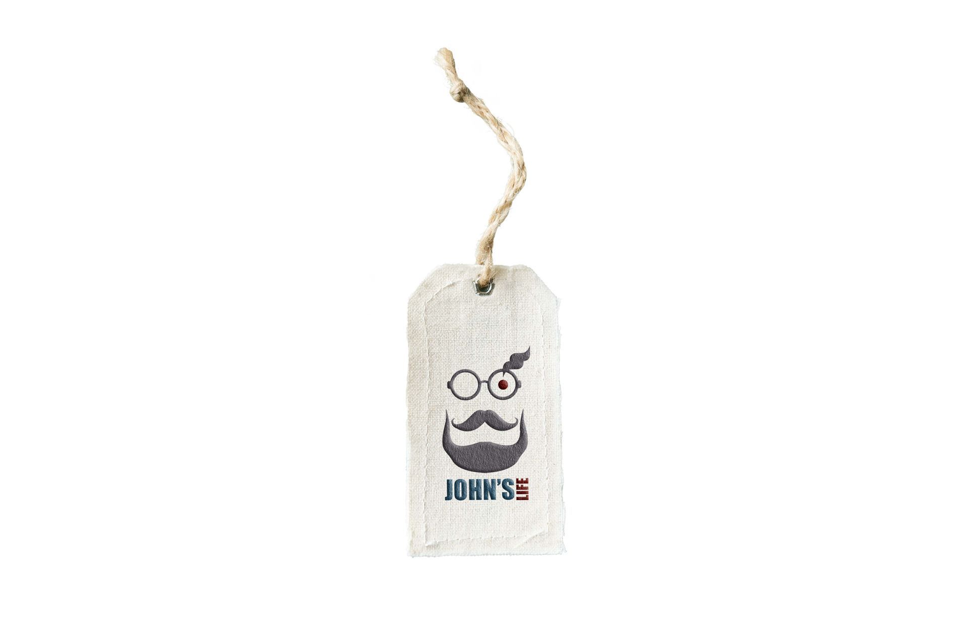 Small white hanging tag with a cartoon face and the words “DON’T S…” on it