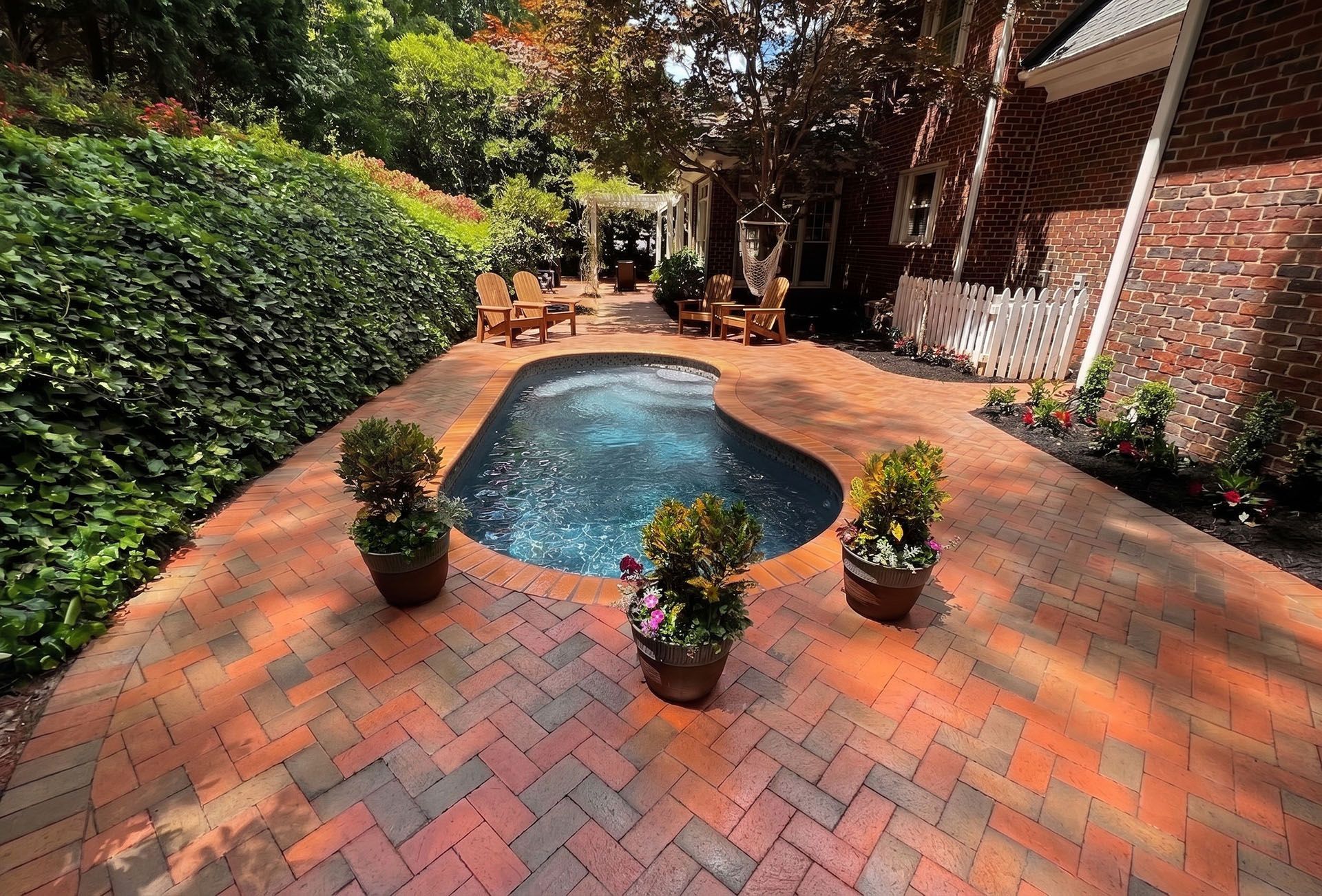 Drained fiberglass pool inspected for gel coat repair