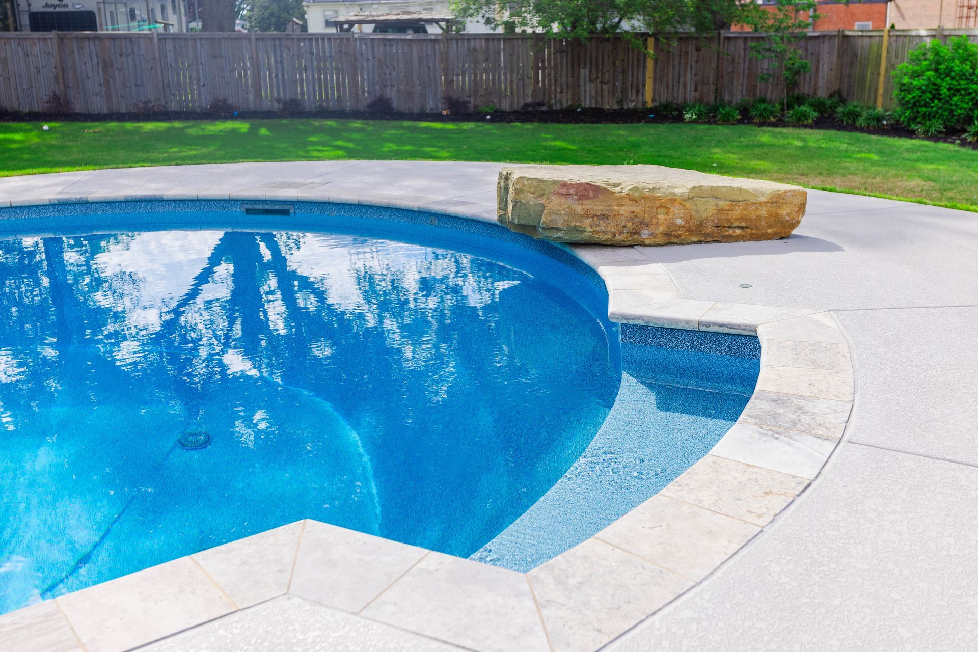 Custom freeform pool design by Aqua Blue Pools