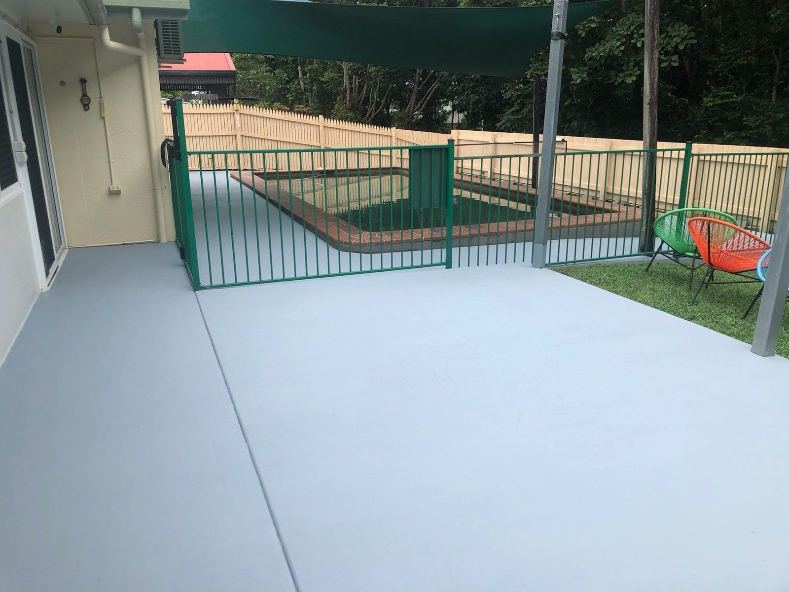 A White House With A Swimming Pool In Front Of It — Pete's Painting Solutions In Smithfield, QLD