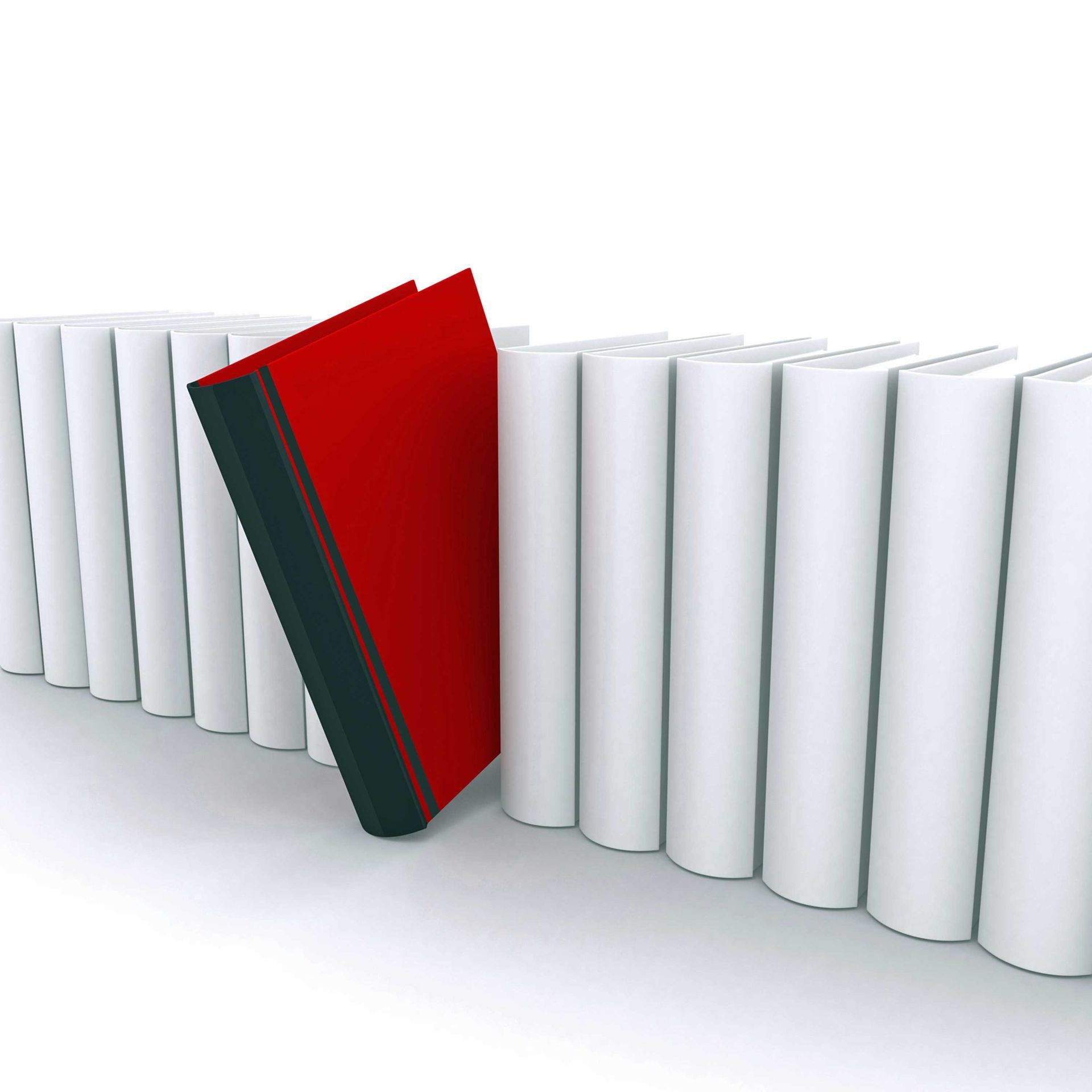 A row of white books with a red book in the middle
