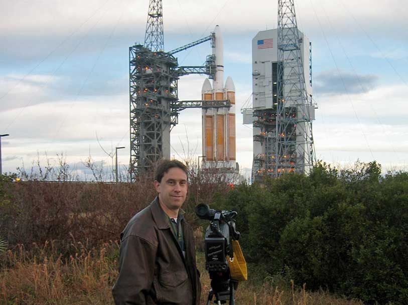 Brayn with a camera in front of a rocket