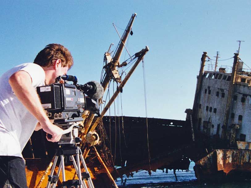 Bryan filming a shipwreck with a canon camera