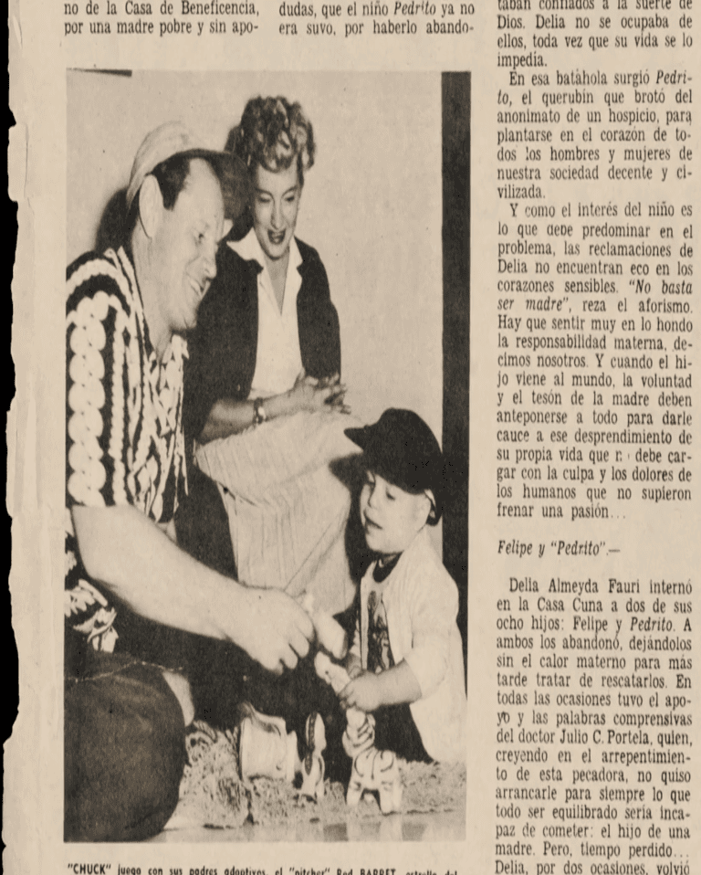 A black and white photo of a man playing with a child