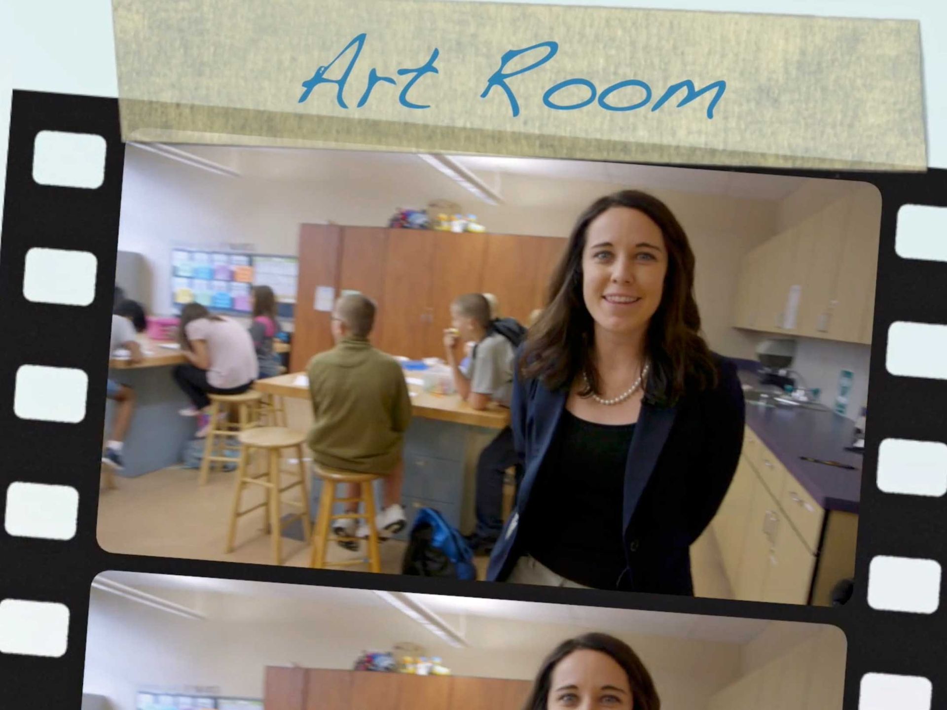 A woman stands in front of a sign that says art room