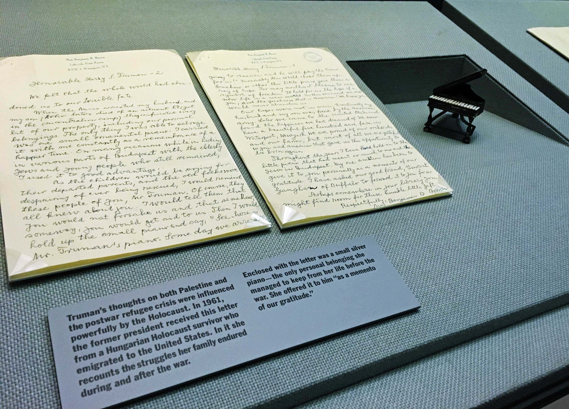 A book is open to a page that says ' letters ' on it