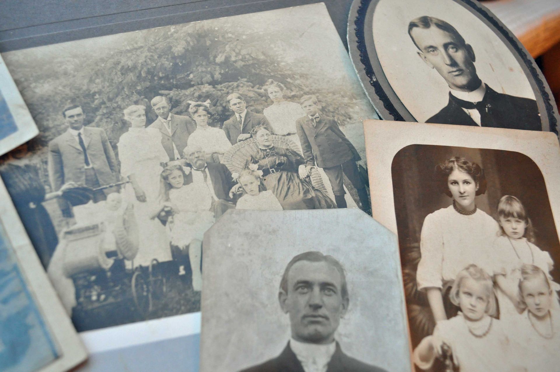 A collection of old black and white photographs of a family