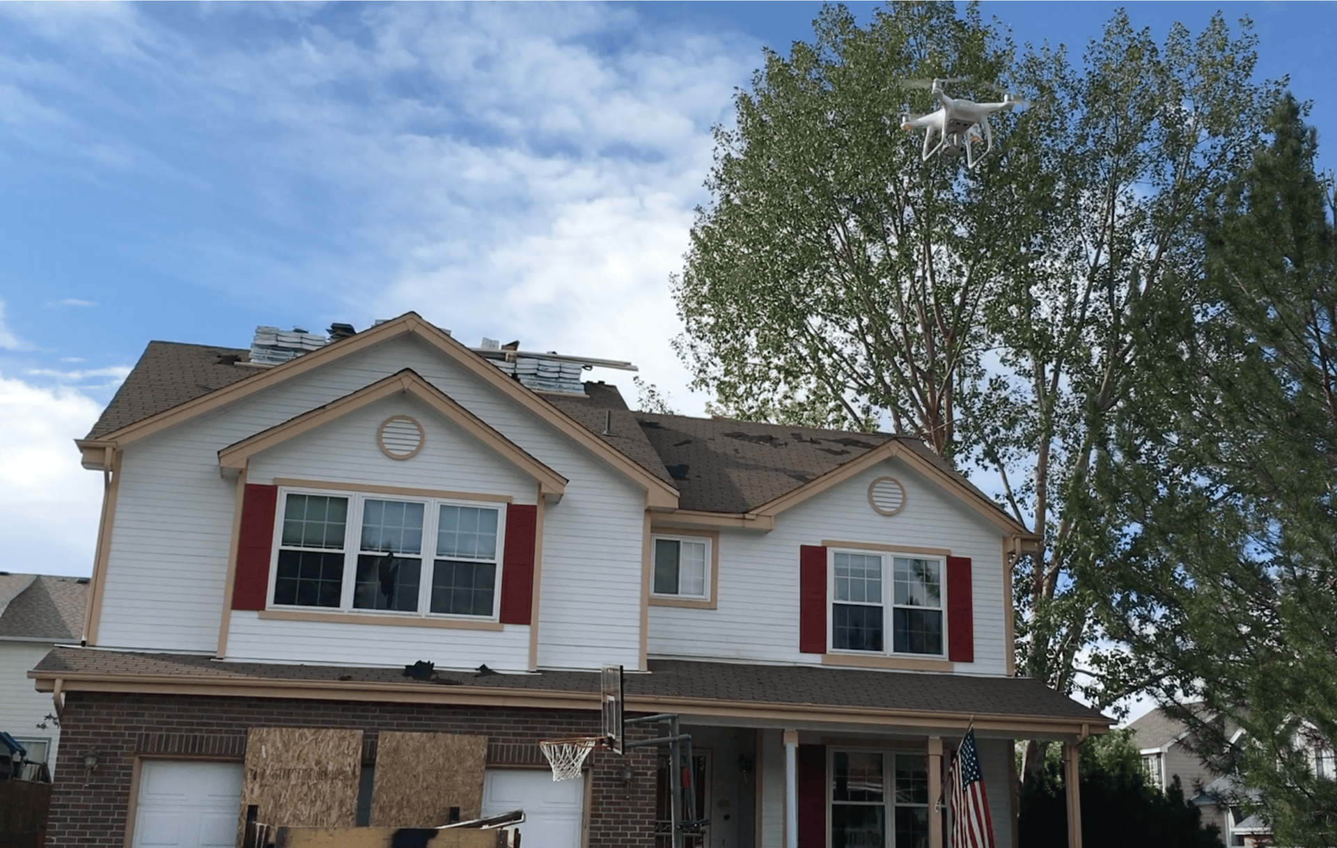 A drone is flying over a house that is being remodeled