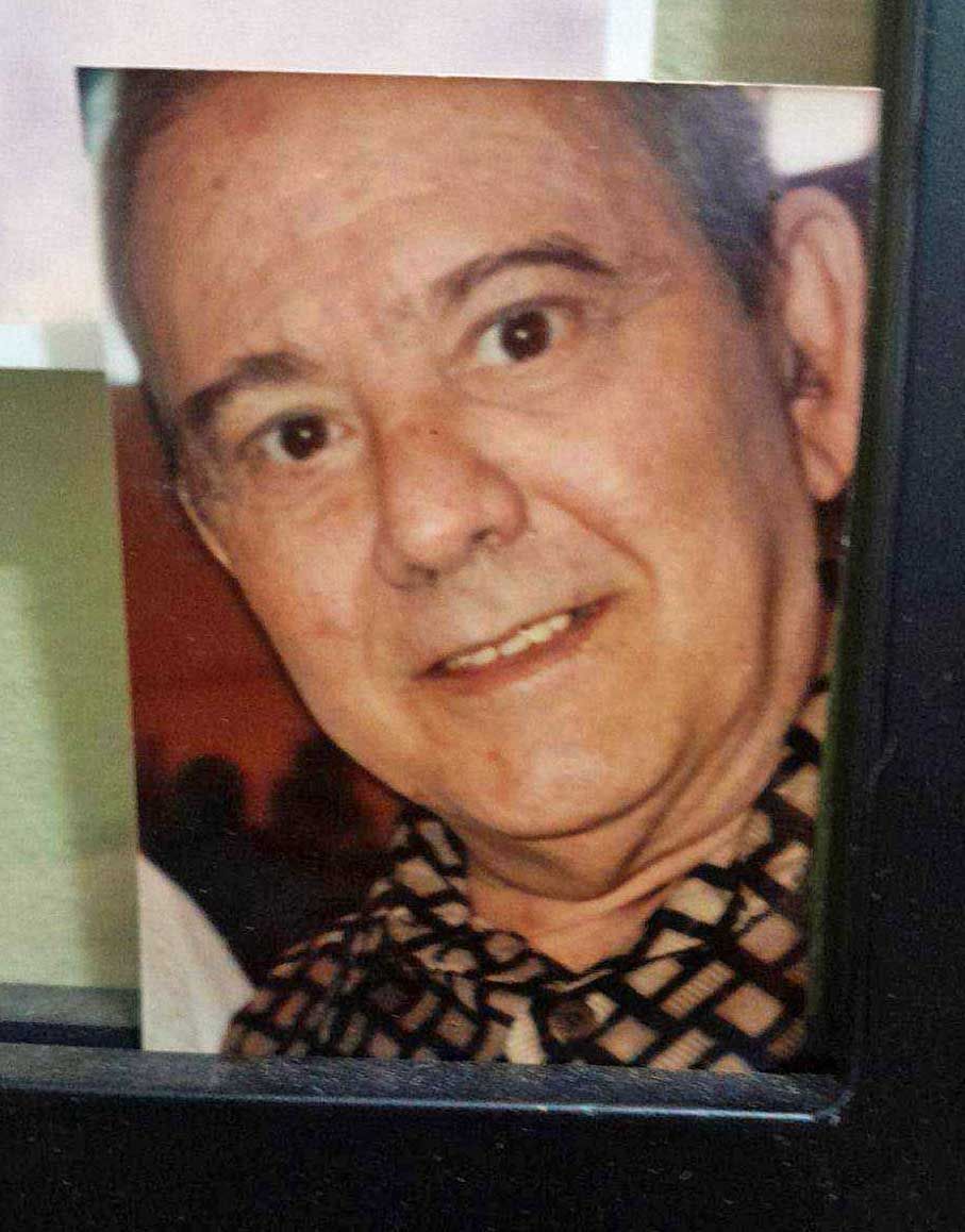 A close up of a man 's face in a picture frame.