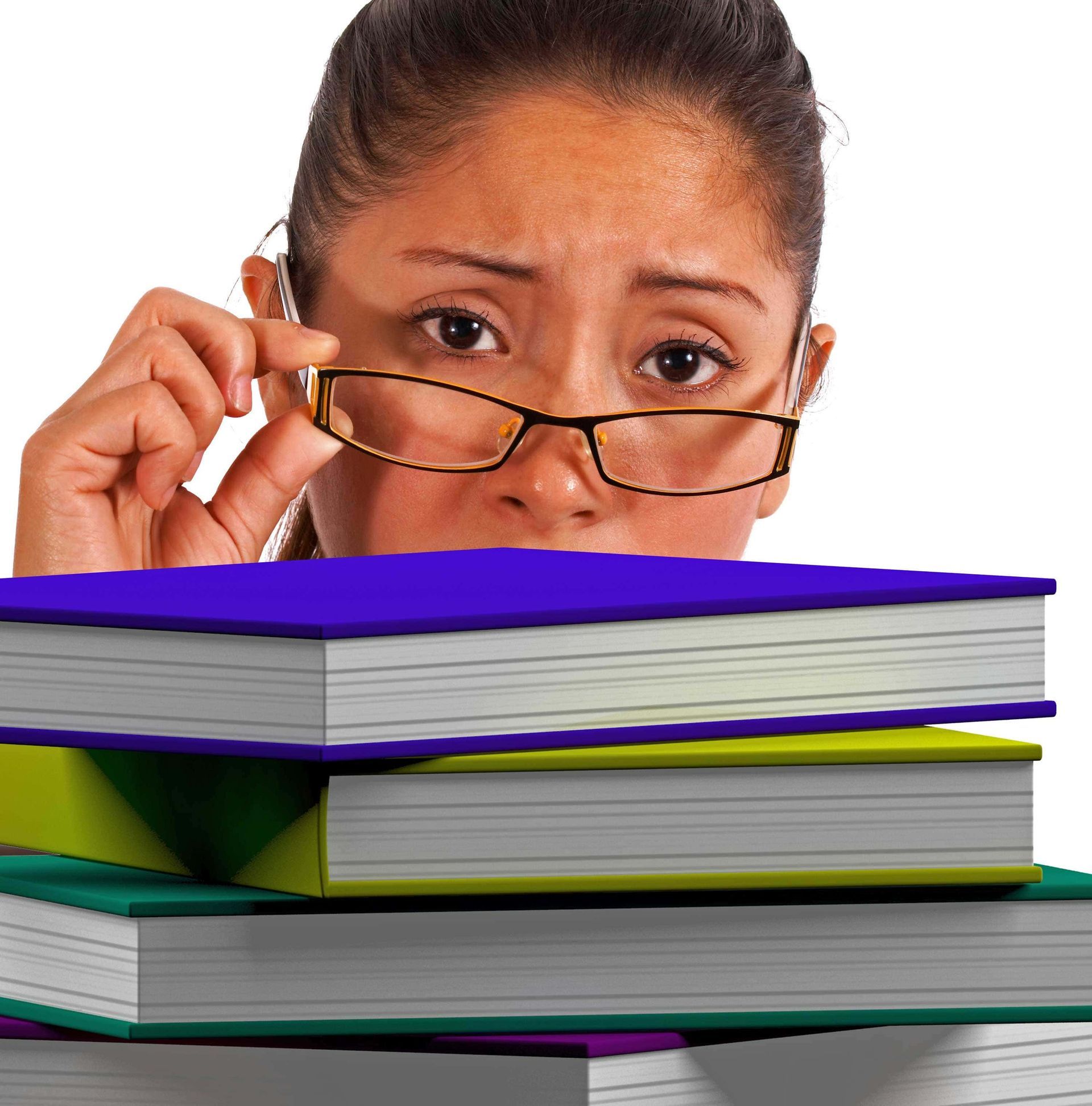A woman wearing glasses looks over a stack of books