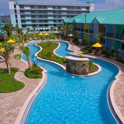 A large swimming pool with a river running through it
