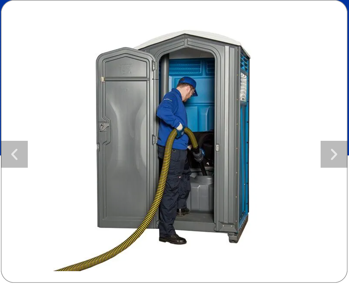 Man emptying portable toilet with a hose. Gray and blue, outdoors.