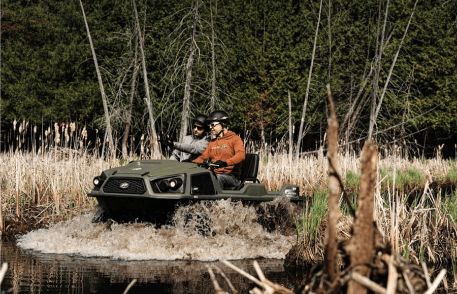 Argo Frontier XTV recreational vehicle entering the swamp with two men.