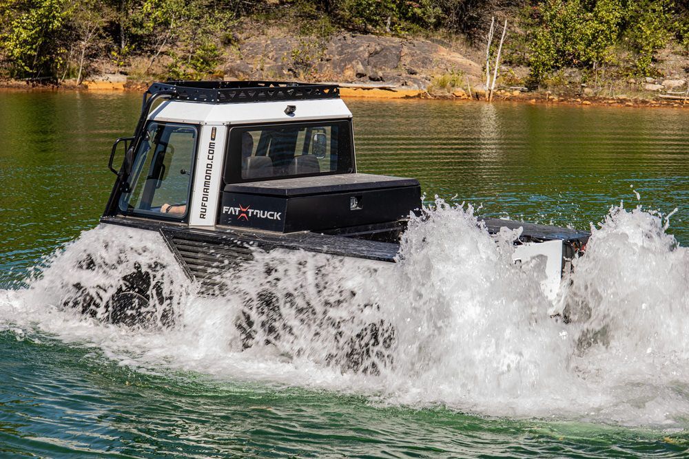 Fat Truck in water. It is an amphibious vehicle.