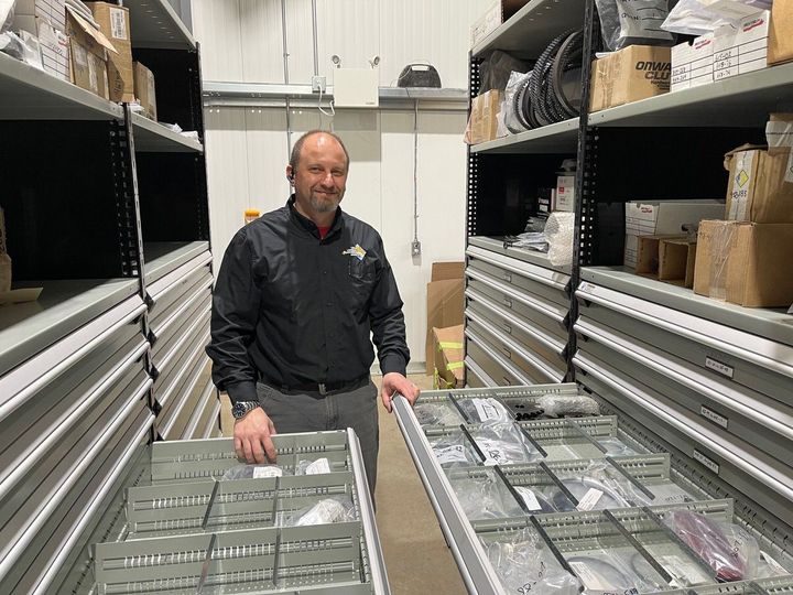 Jorge Dias standing in the parts department at Loch Lomond Equipment Sales.