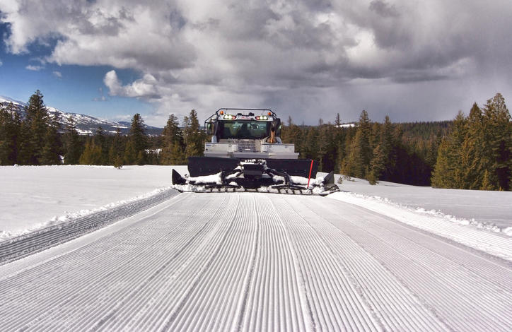 Prinoth Bison clearing a snow road.