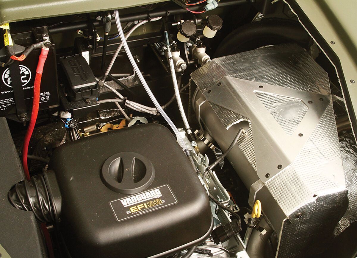 a vanguard XTV engine sits underneath the hood of a vehicle