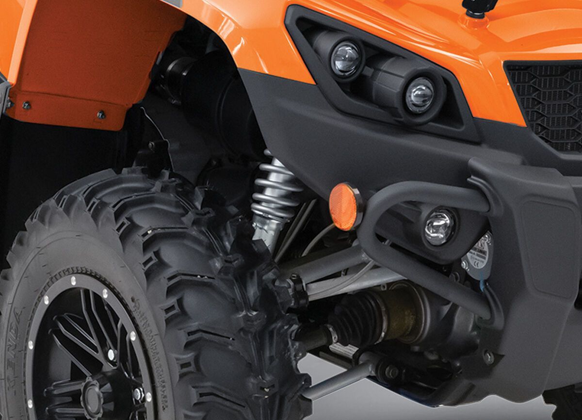 A double A-arm front suspension on an orange ATV.