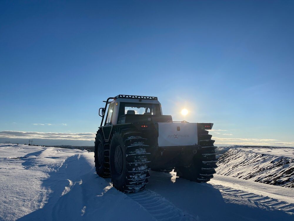 Fat Truck on the snow with the low winter sun in the background.