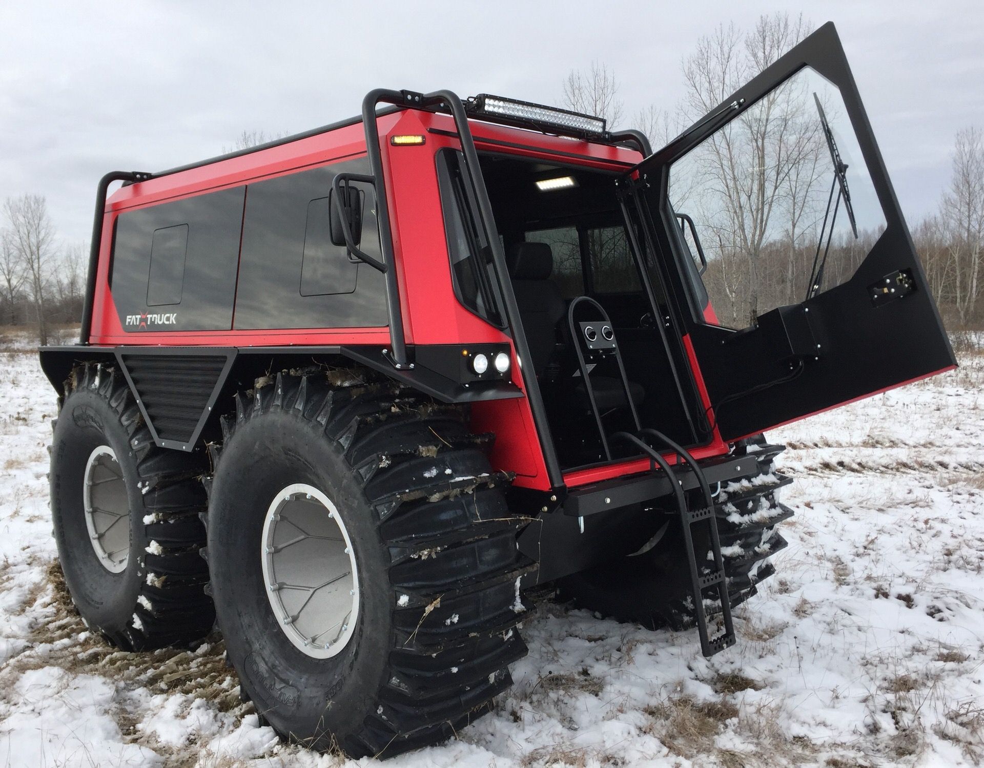 A red Fat Truck opened and showing the safety features.