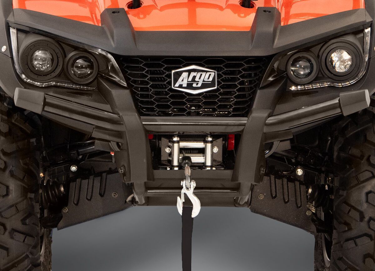 Suspension on an orange ATV.
