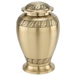 Gold-colored urn with leaf design around the top and bottom, and on the lid.