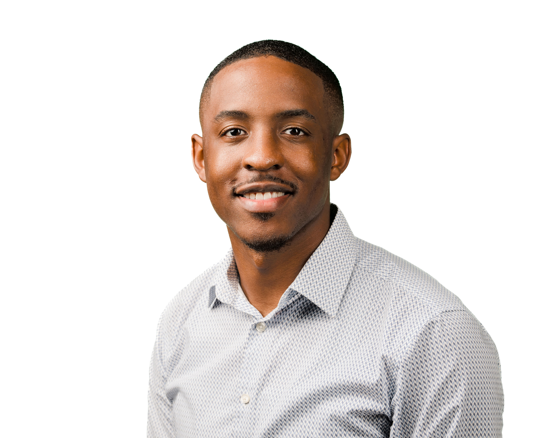 Portrait of a smiling person in a light gray checkered shirt against a white background