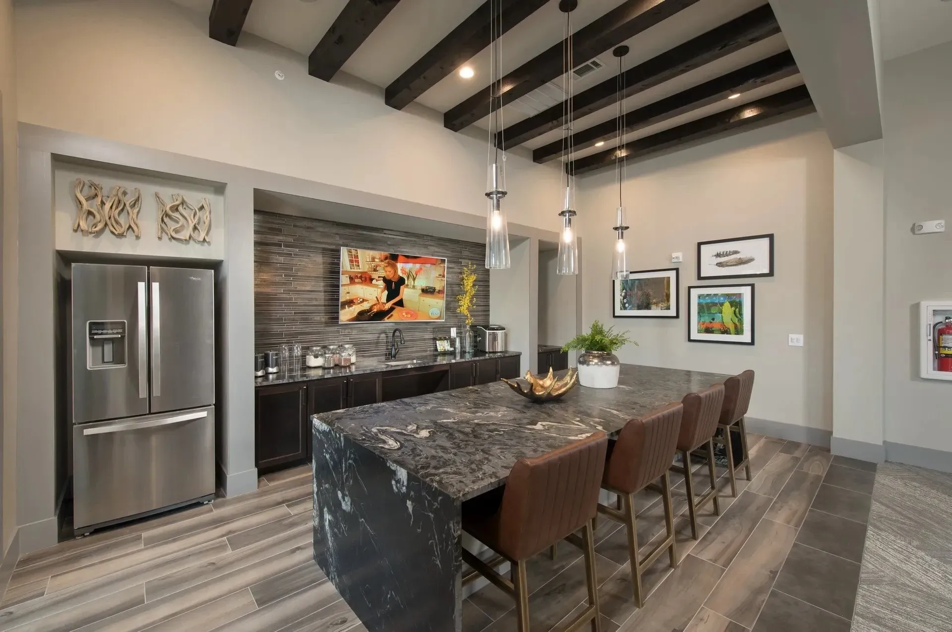 Modern kitchen area with a large island and seating
