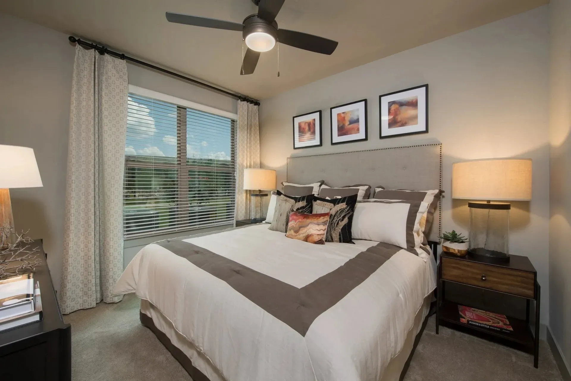 Cozy bedroom with a bed, bedside tables, and window.