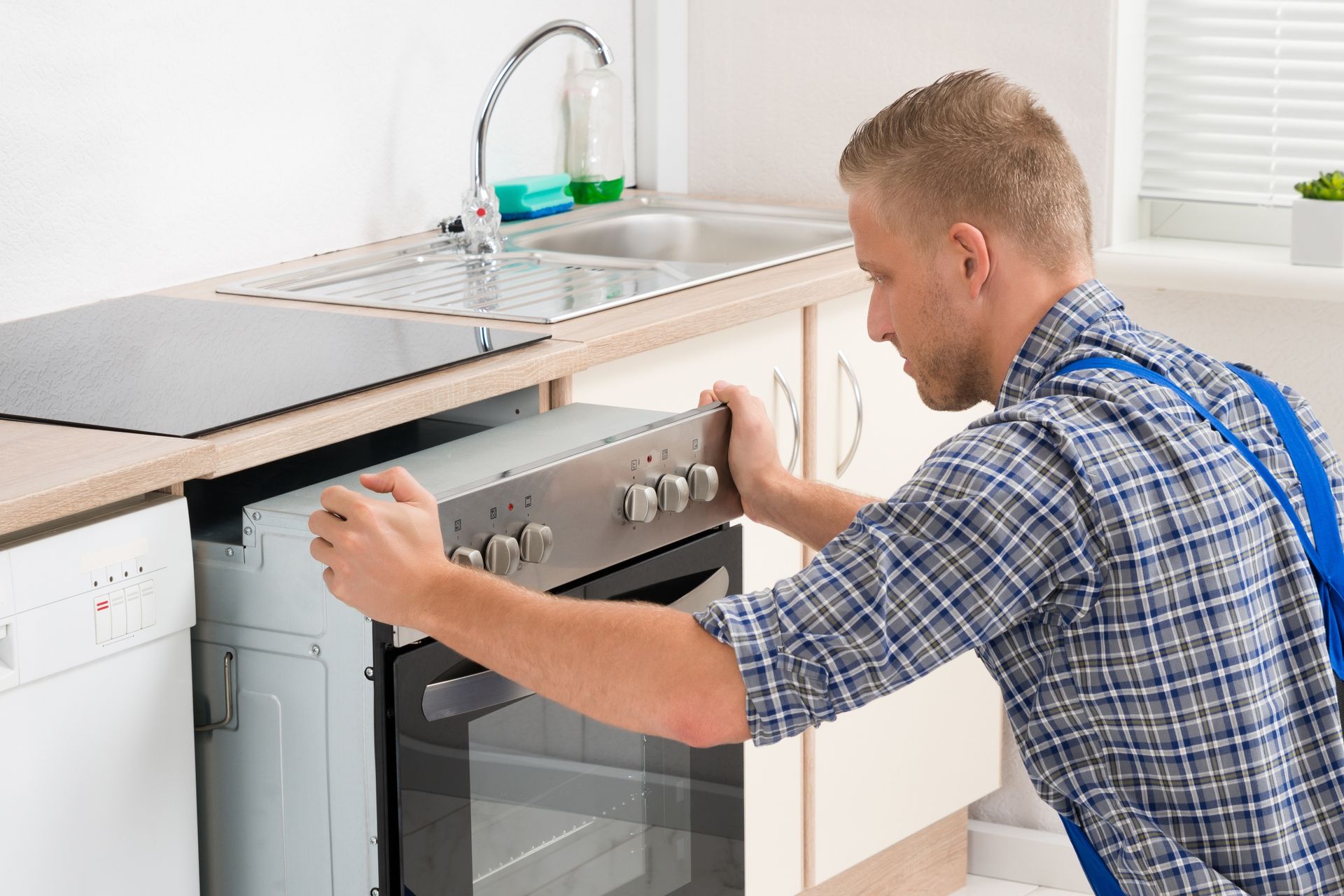 Man Repairing an Appliance