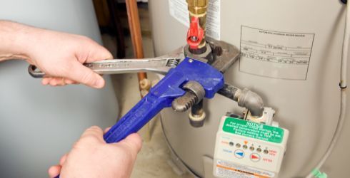 A Close up Of a Hose with A Gauge Attached to It | Neenah, WI | Ogden Plumbing