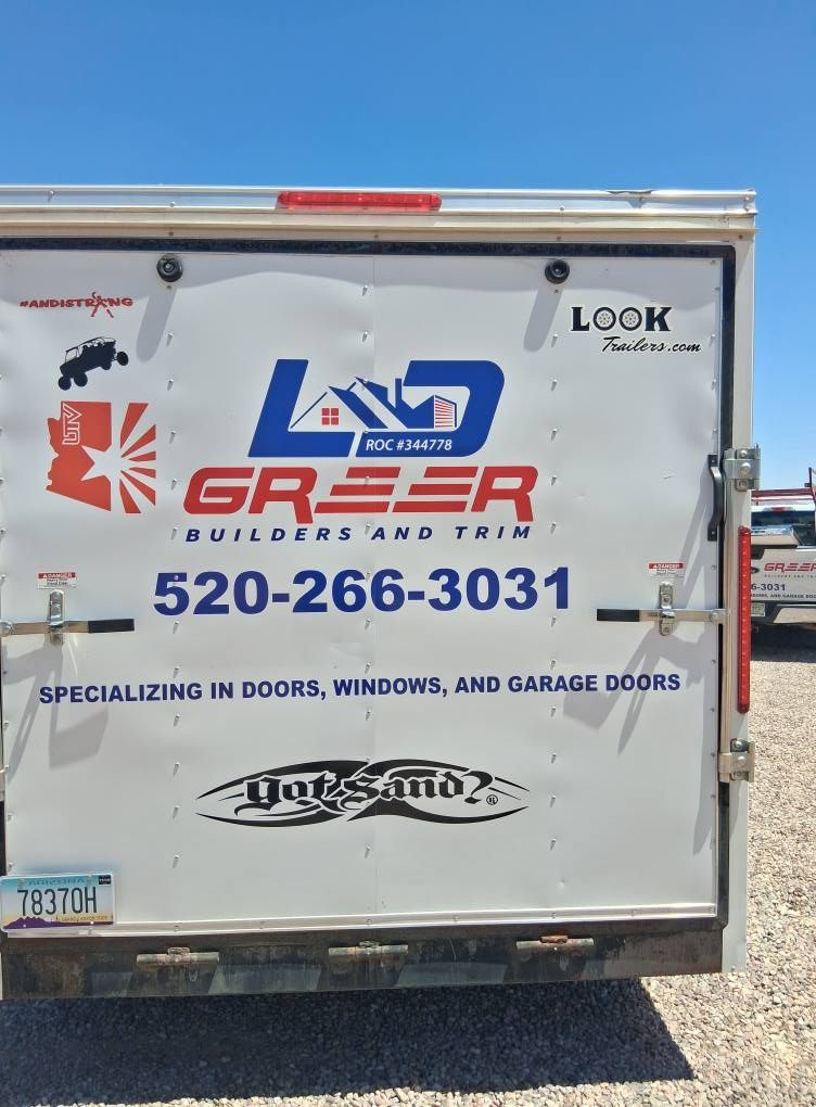 The back of a trailer that says greeer builders and trim