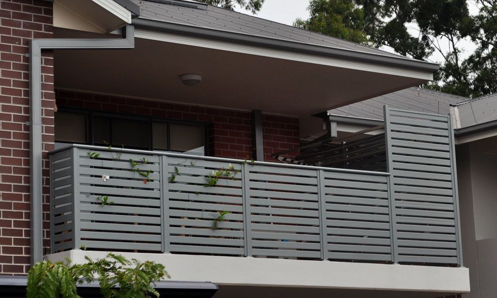 A Balcony on the Side of a Brick House — Rearden Fencing Pty Ltd in Toronto, NSW