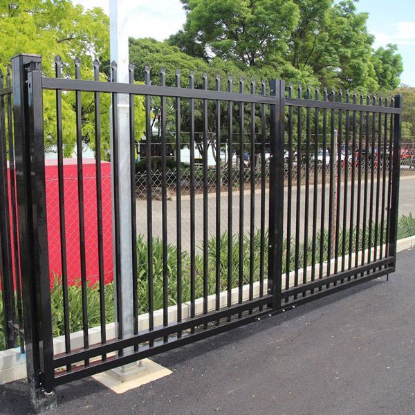 A Black Fence With a Red Sign in the Background — Rearden Fencing Pty Ltd in Toronto, NSW