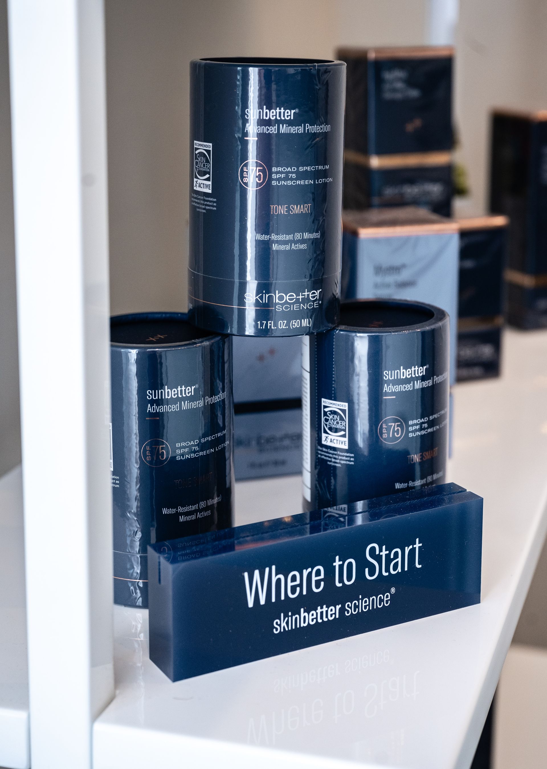 Black cans displayed on a shelf above a sign reading “Where to Start”
