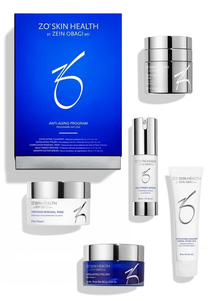 Zo Skin Health blue-and-silver skincare product set, including box, jars, bottles, and tube on white background
