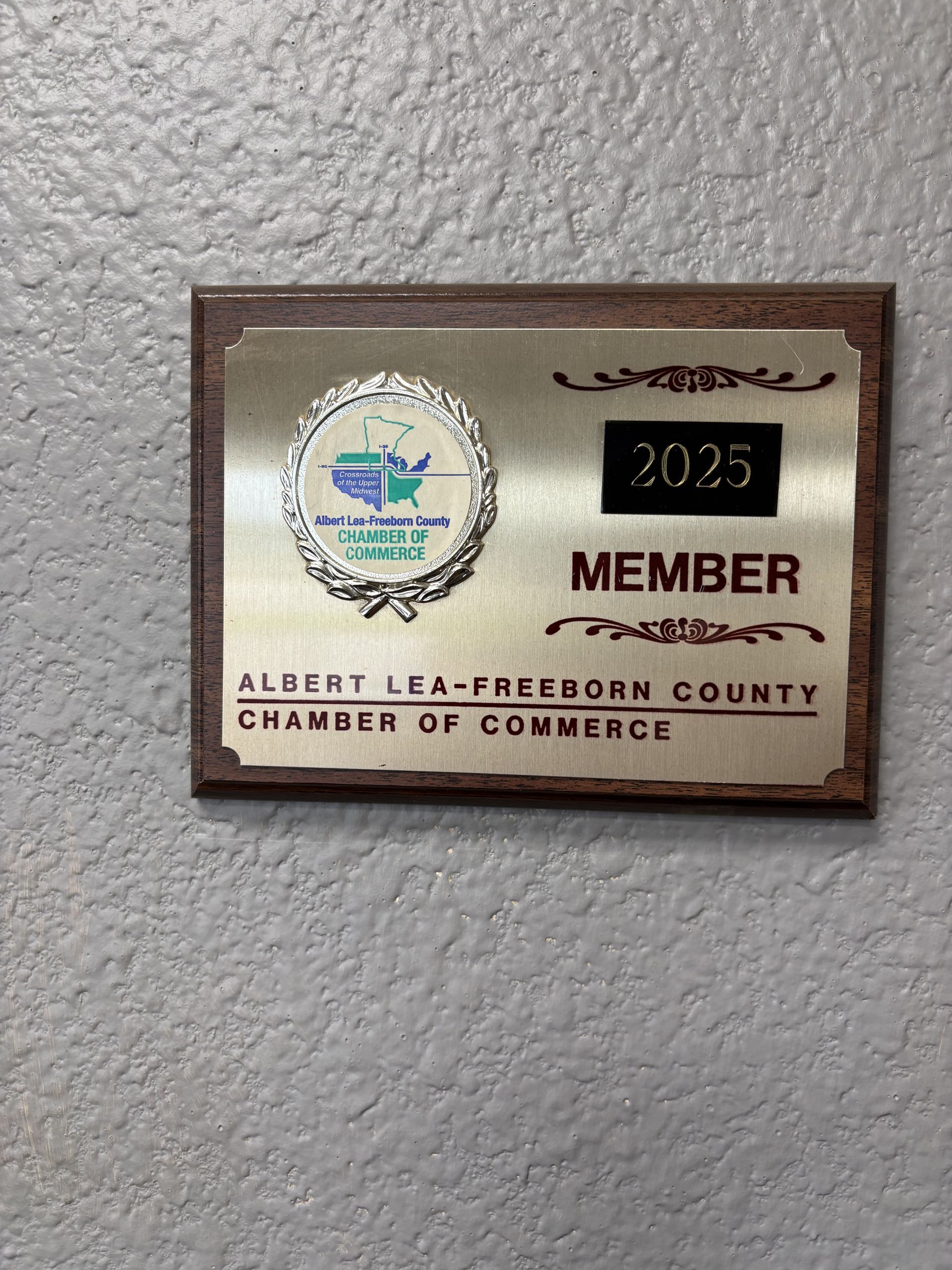 2025 member plaque for Albert Lea-Tribee County Chamber of Commerce on a textured wall
