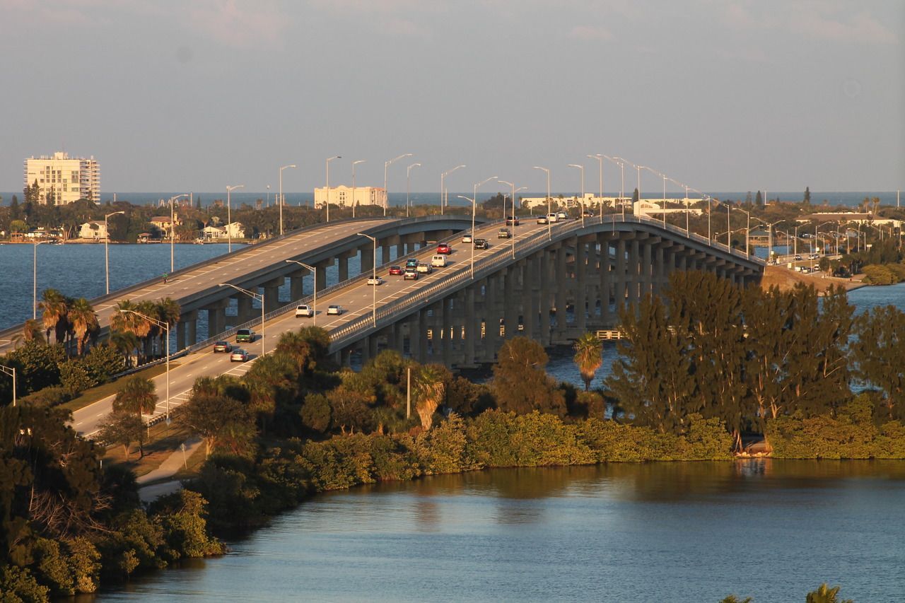 An aerial view of a bridge over a body of water.
