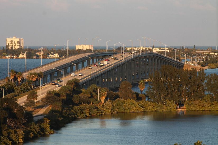An aerial view of a bridge over a body of water.