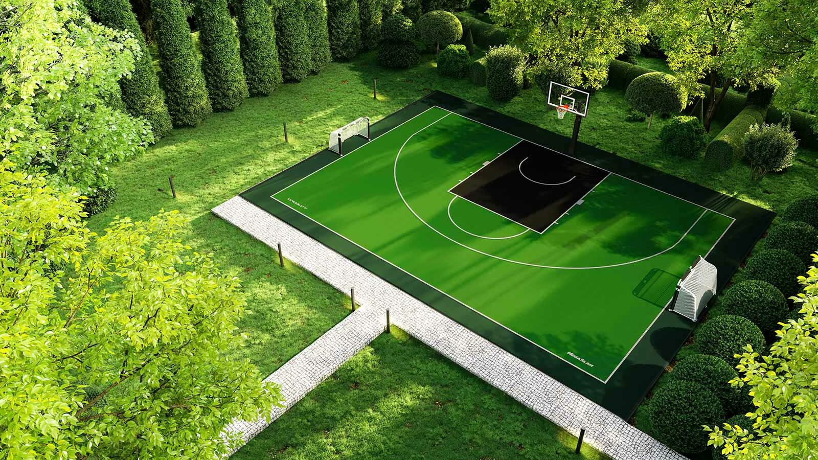 Aerial view of a green sports court surrounded by trees and a path in a park-like setting