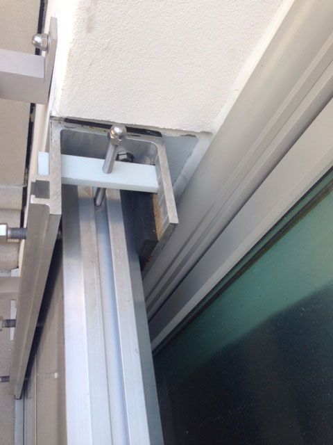 A close up of a sliding glass door on a building