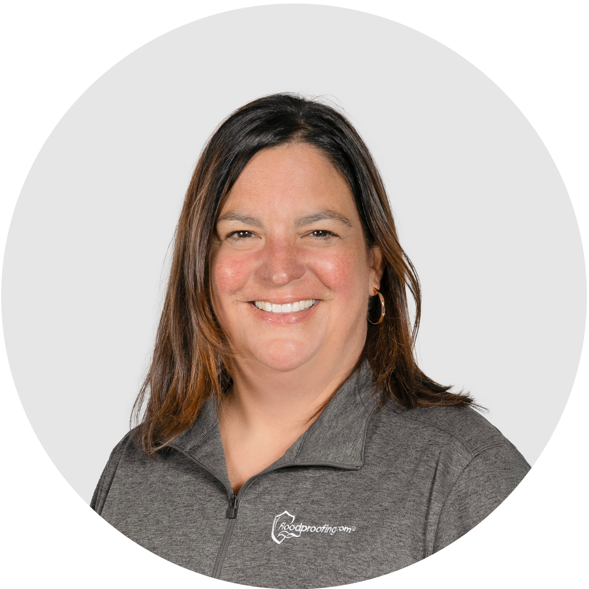 A woman is smiling in a circle on a white background.