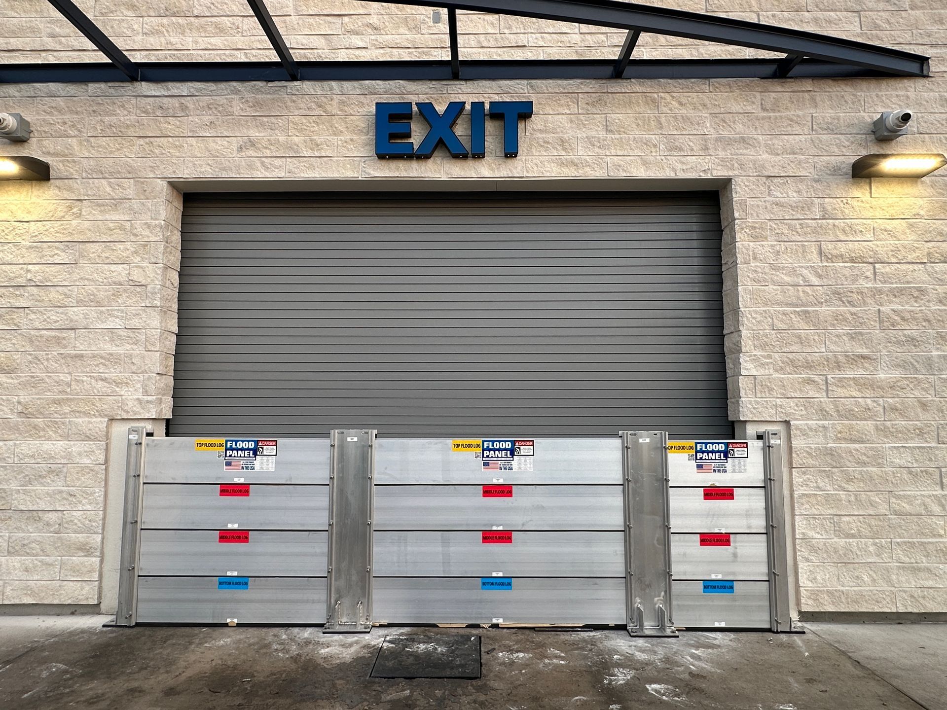 A garage door with a sign above it that says exit