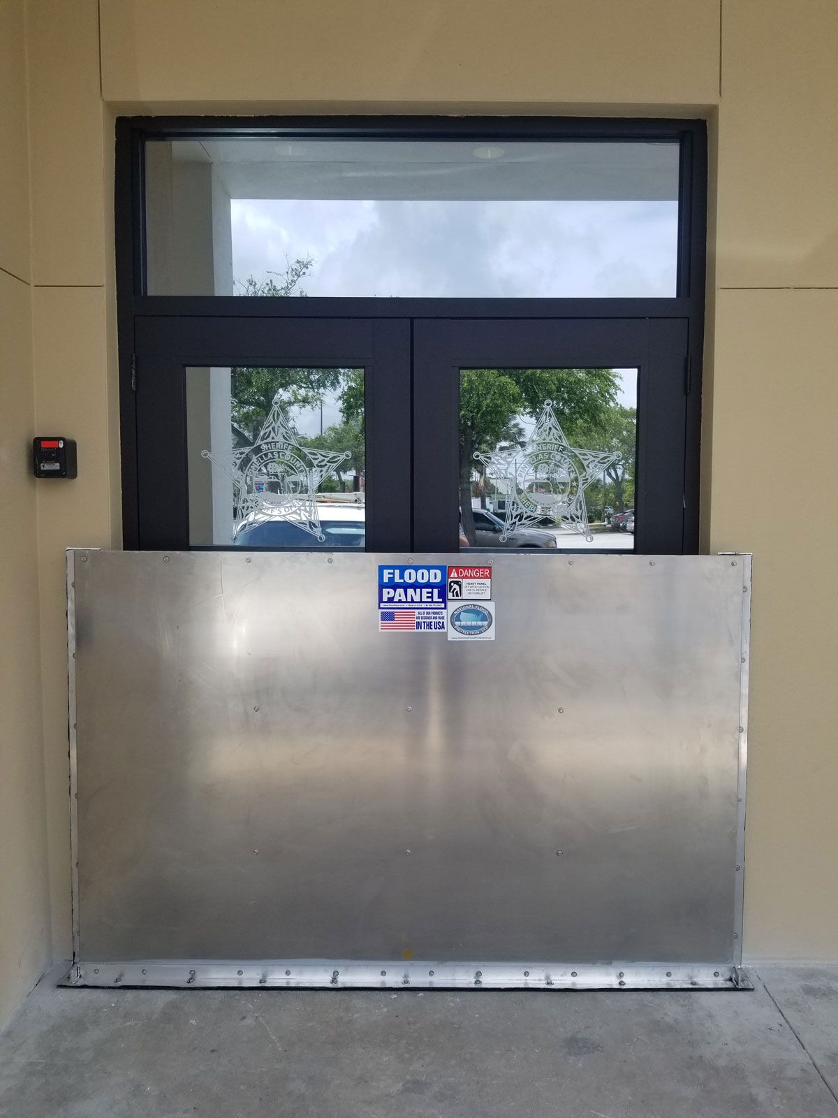 A stainless steel door with a sticker on it that says