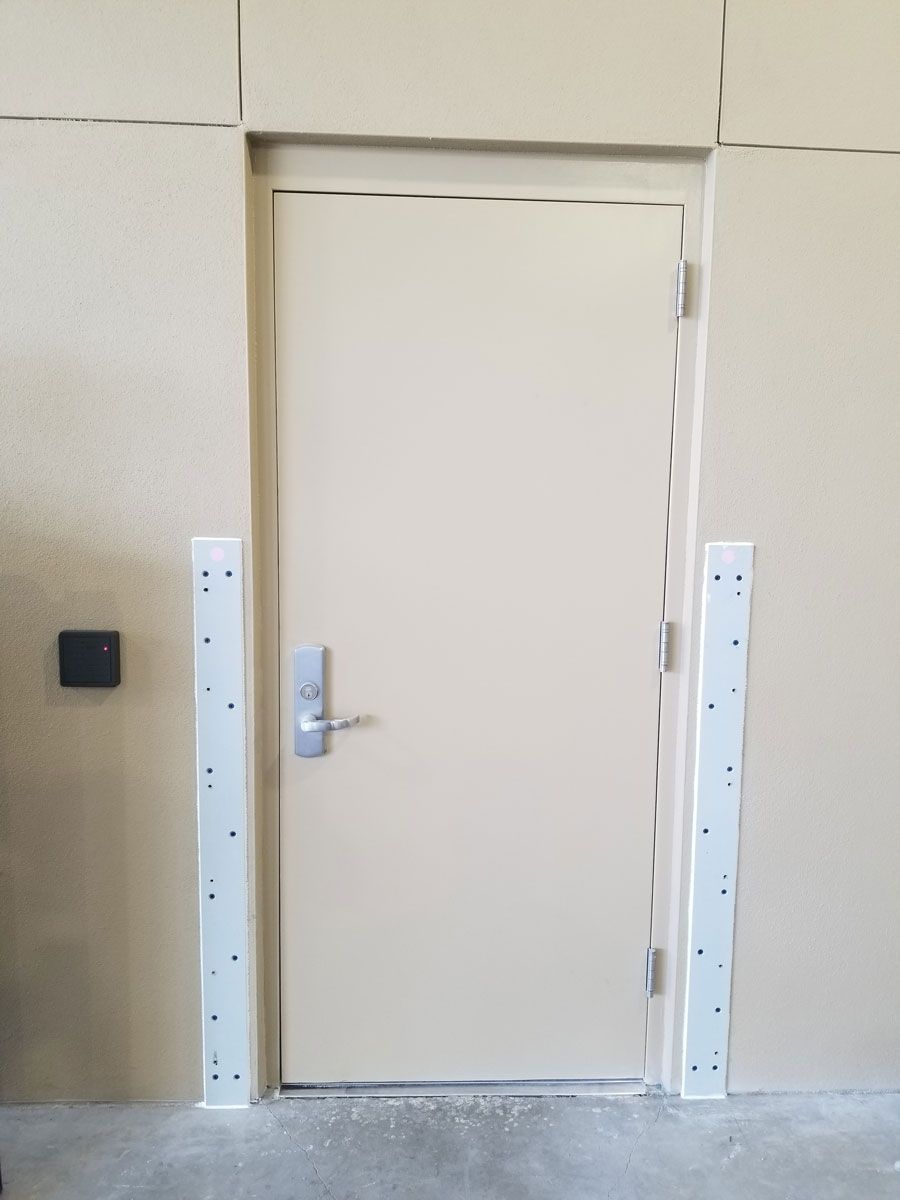 A door in a wall with a lock on it.