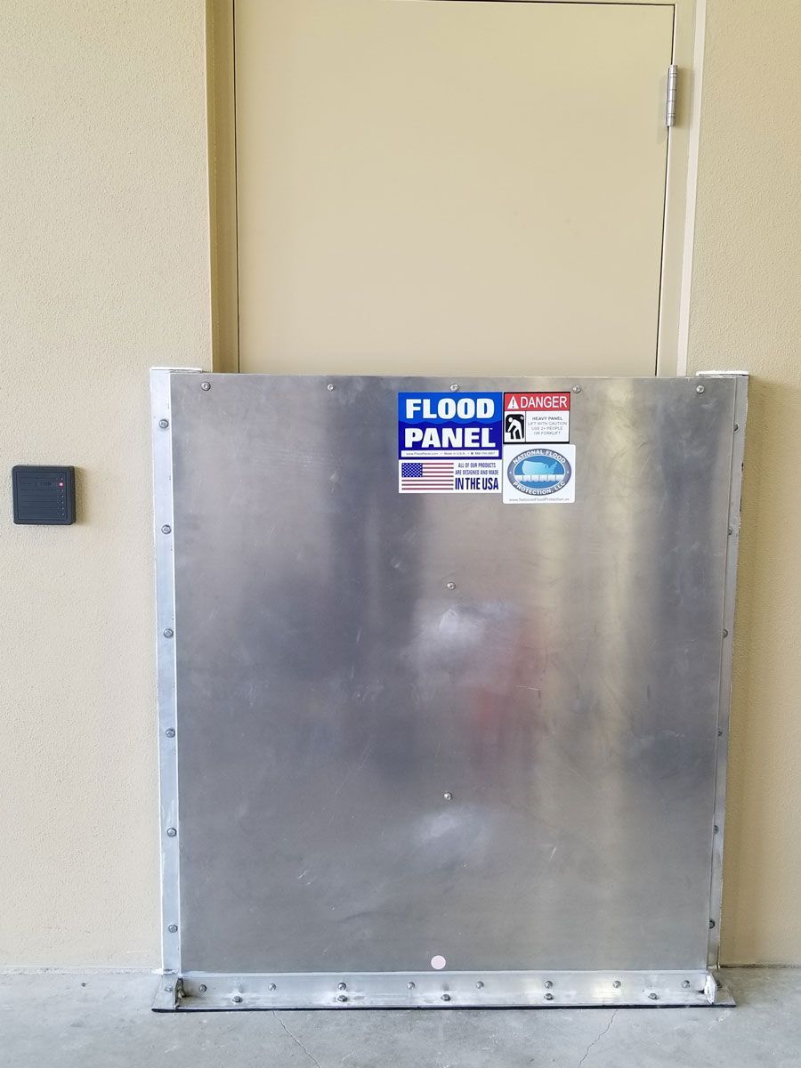 A flood panel is sitting in front of a door.