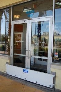 A door with a flood barrier in front of it.